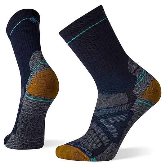 A pair of SmartWool Hike Light Cushion Crew socks in red and black, featuring a crew length and mesh zones on the side.