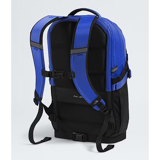Blue and black backpack on a light gray background