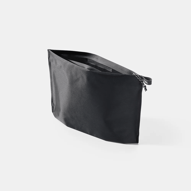 Load image into Gallery viewer, Black pouch with zipper on a white background
