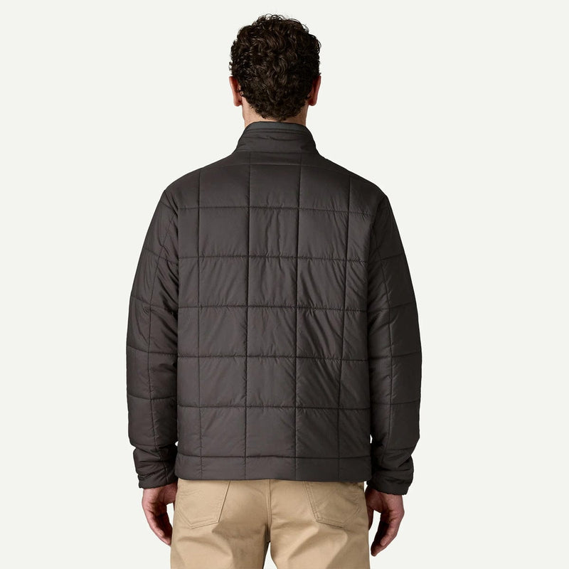 Load image into Gallery viewer, Man wearing a dark gray quilted jacket on a white background
