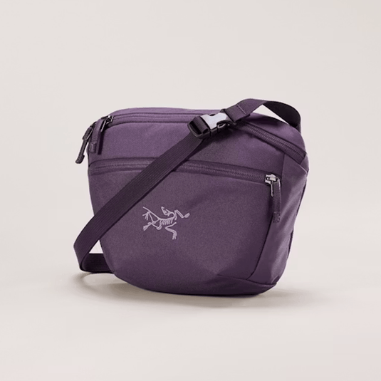 Purple crossbody bag with a brand logo on a light gray background