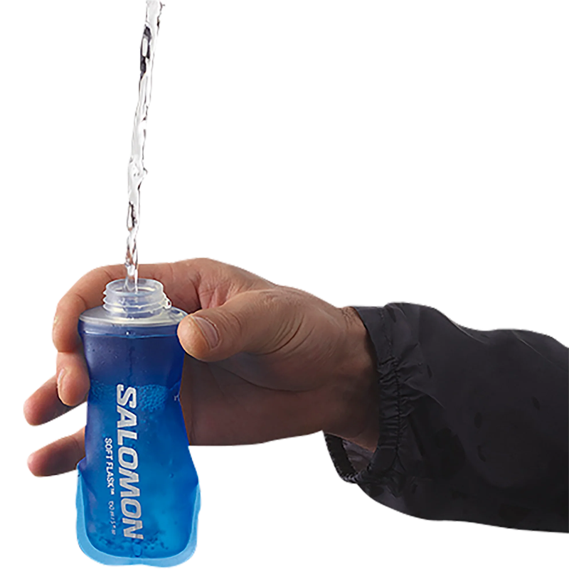 Load image into Gallery viewer, Hand holding a blue Salomon soft flask with water being poured.
