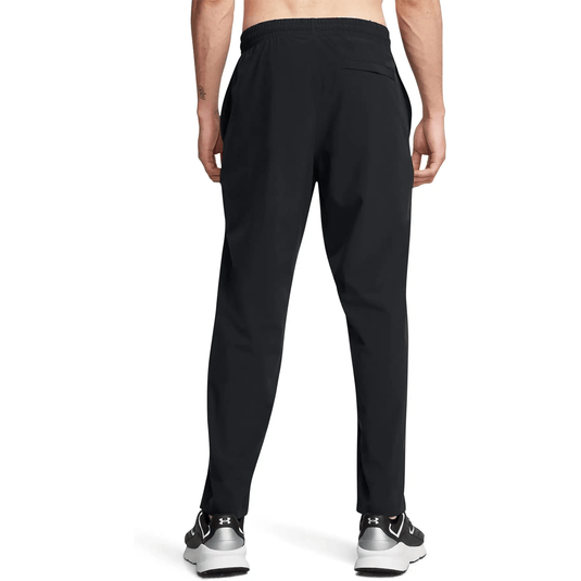 Person wearing black pants on a white background