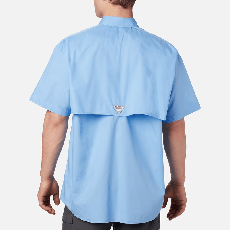 Load image into Gallery viewer, Light blue shirt worn by a person on a white background
