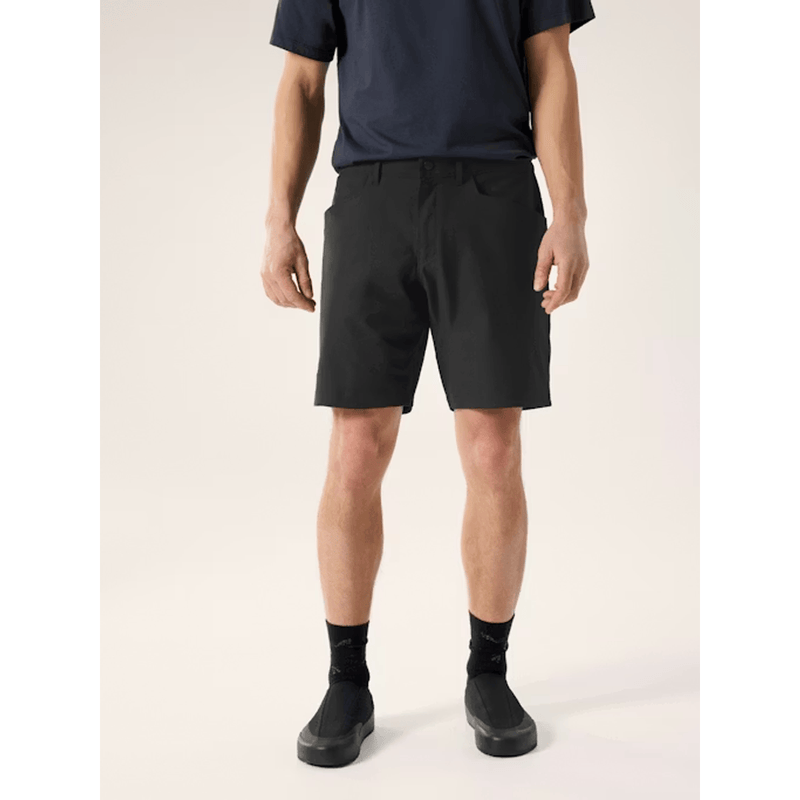 Load image into Gallery viewer, Person wearing black shorts and black shoes on a plain background
