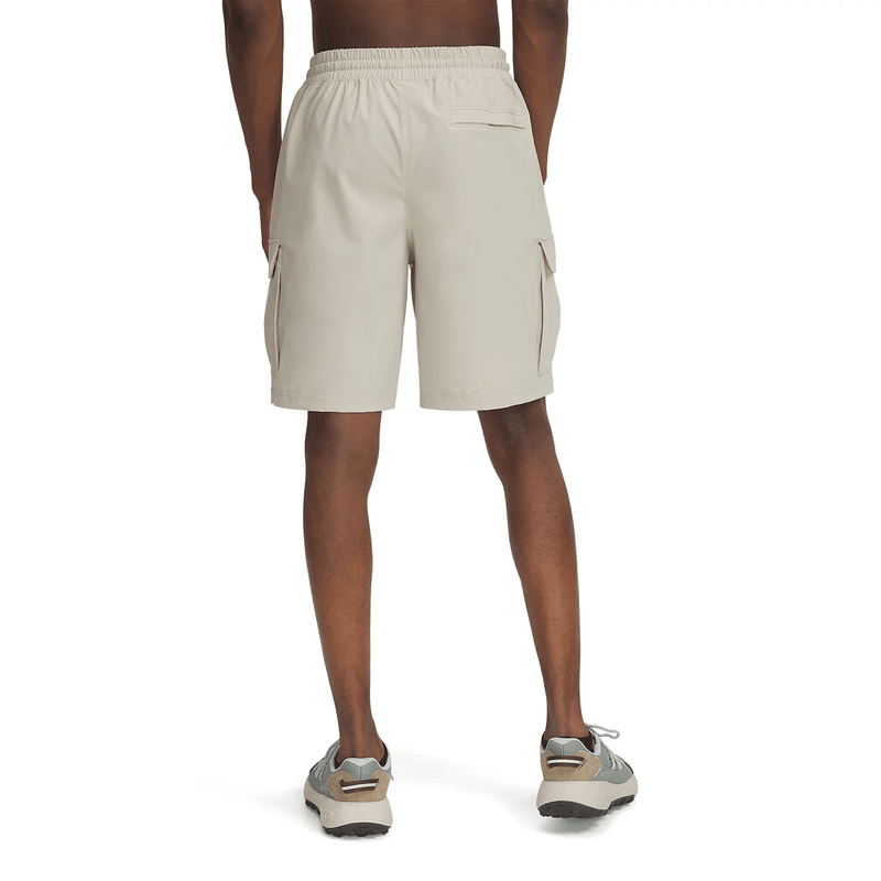 Load image into Gallery viewer, Beige cargo shorts worn by a person on a white background
