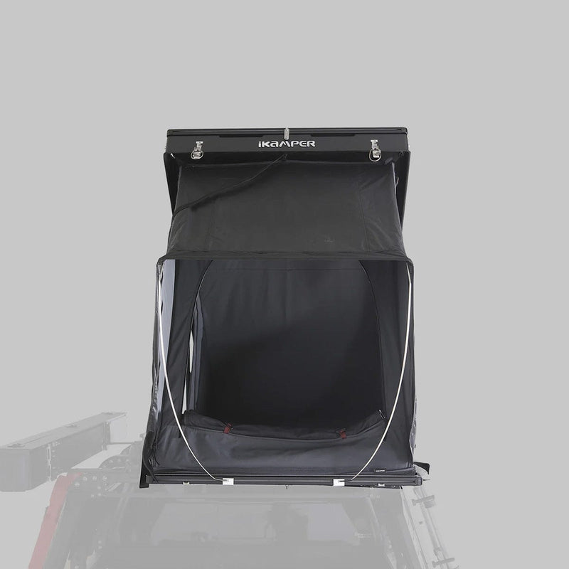 Load image into Gallery viewer, Black rooftop tent with 'ikamper' branding on a gray background
