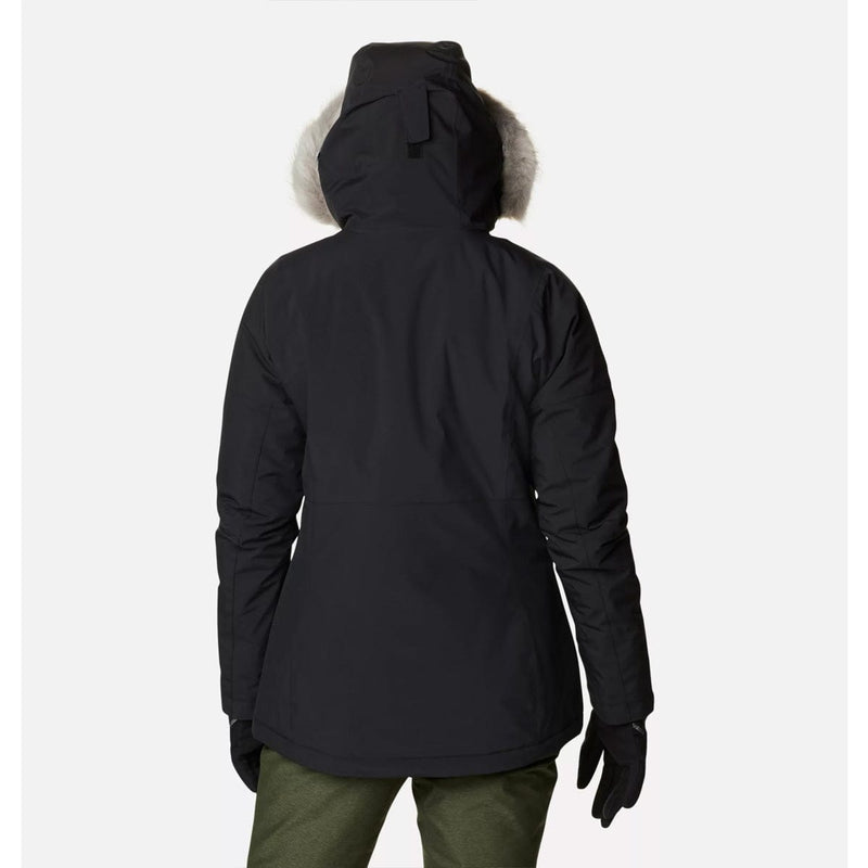Load image into Gallery viewer, Person wearing a black winter jacket with fur hood on a white background
