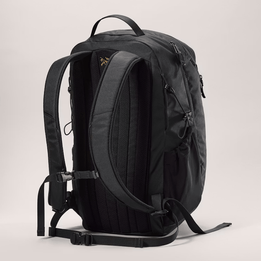 Black backpack on a light gray background