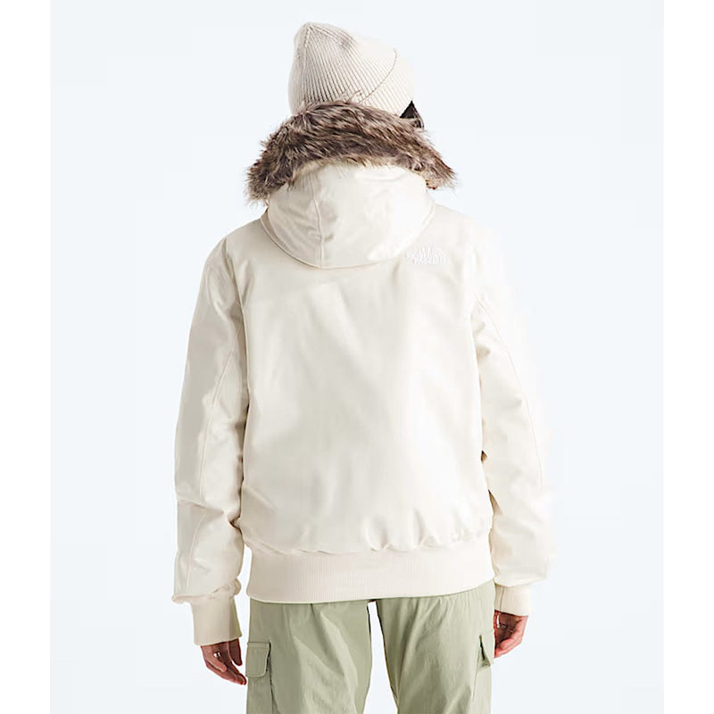 Load image into Gallery viewer, Person wearing a white jacket with fur hood and light green pants on a white background
