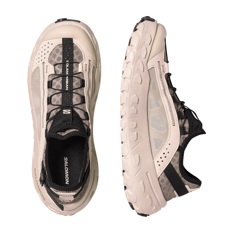 Load image into Gallery viewer, Beige and black running shoes with 'Salomon' branding on a white background
