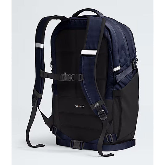 Black and navy backpack with visible brand logo on a light gray background