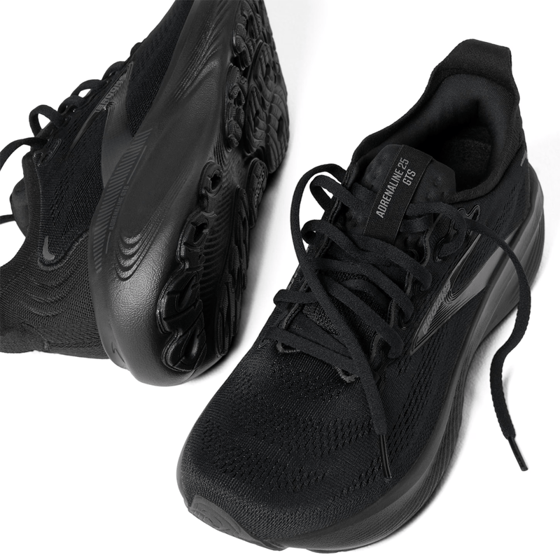 Load image into Gallery viewer, Black athletic shoes on a white background
