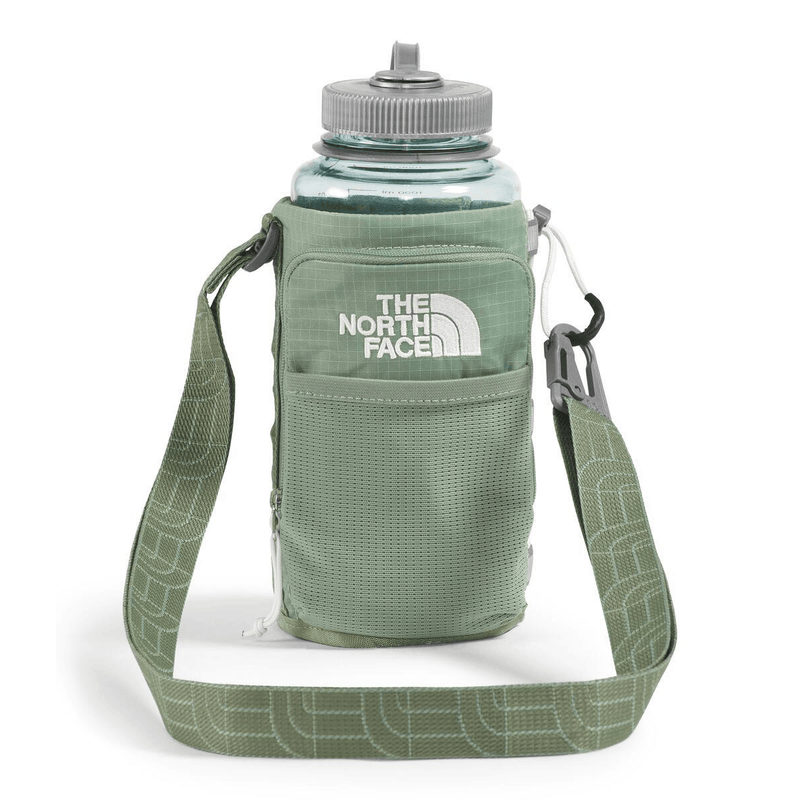 Load image into Gallery viewer, Green water bottle holder with strap featuring The North Face logo on a white background
