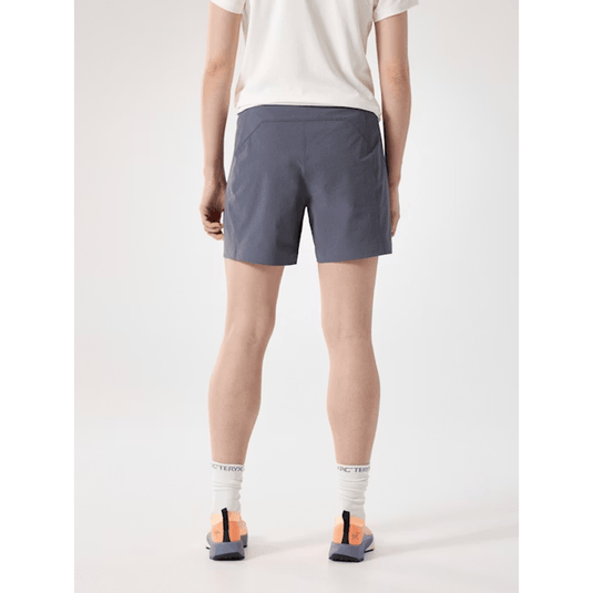 Person wearing gray shorts on a white background