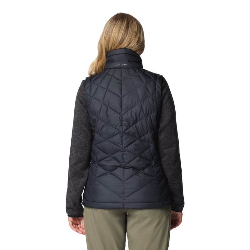 Load image into Gallery viewer, Person wearing a black quilted jacket on a white background
