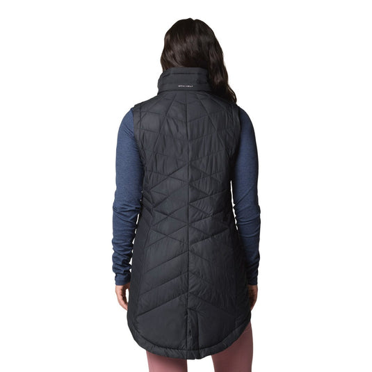 Black quilted vest worn by a person on a white background