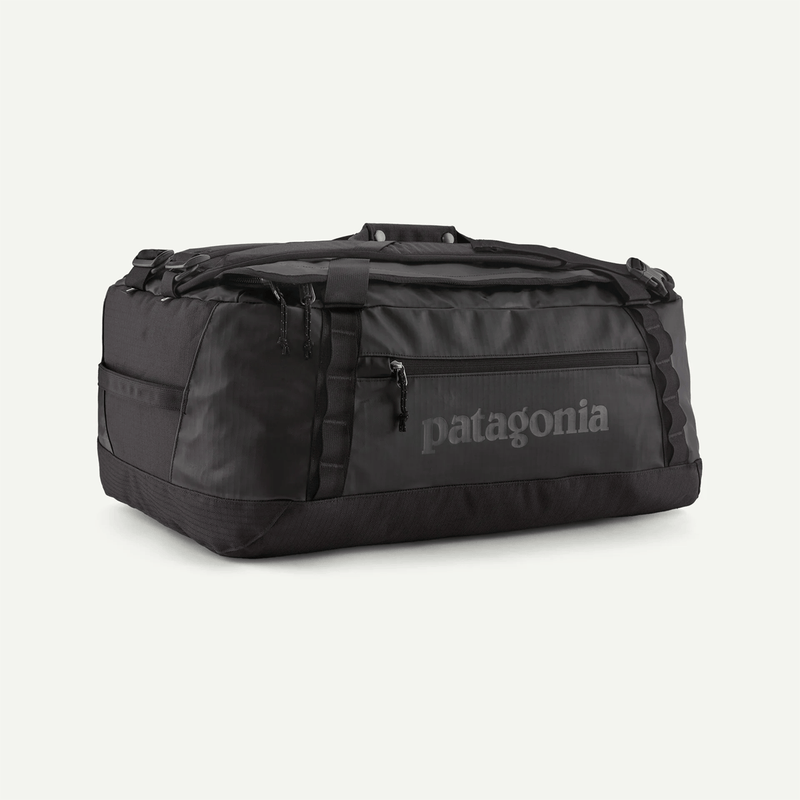 Load image into Gallery viewer, Black duffel bag with Patagonia logo on a white background
