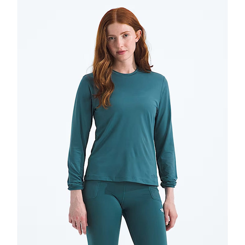 Load image into Gallery viewer, Woman wearing a teal long-sleeve top and leggings on a white background
