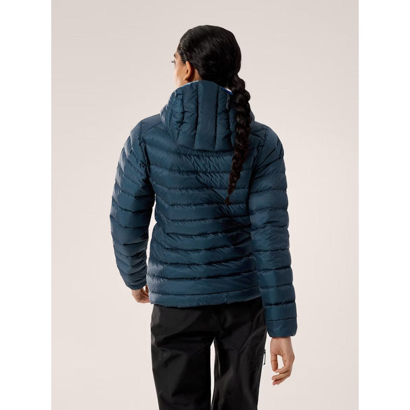 Load image into Gallery viewer, Person wearing a blue puffer jacket on a plain background
