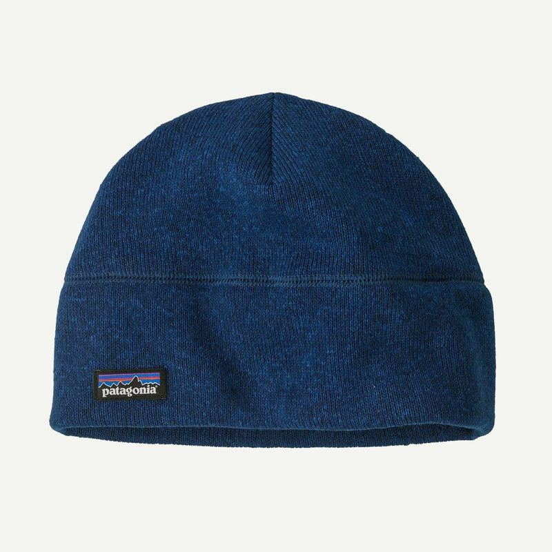 Load image into Gallery viewer, Blue knit beanie with Patagonia logo on a light gray background
