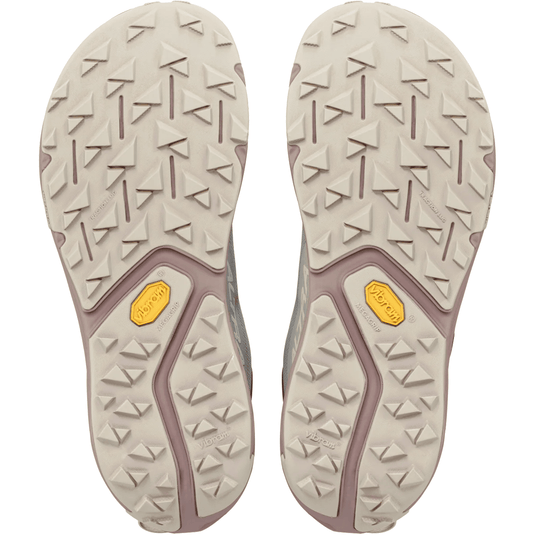 Close-up of the sole of a shoe with a textured pattern on a white background