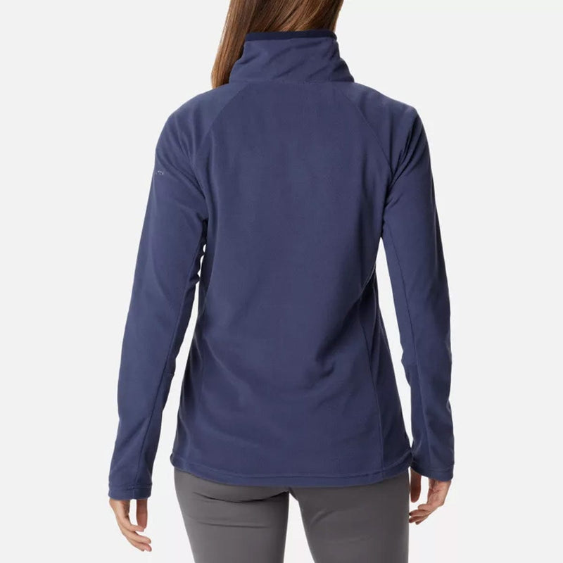 Load image into Gallery viewer, A woman wearing a navy blue Columbia Glacial IV half zip fleece pullover with long sleeves.
