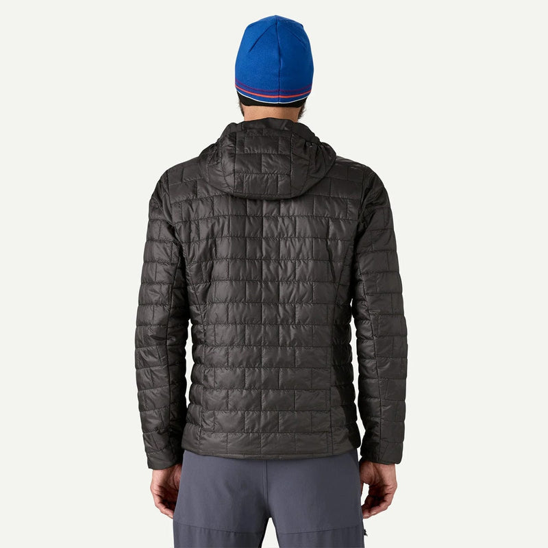 Load image into Gallery viewer, Person wearing a gray quilted jacket and blue beanie on a white background
