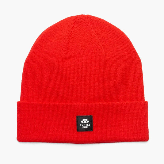 Red beanie with a brand label on a white background