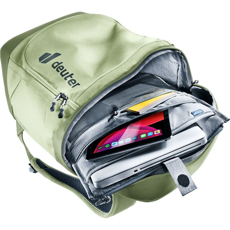 Load image into Gallery viewer, Green backpack with a laptop and tablet inside, featuring the Deuter brand.
