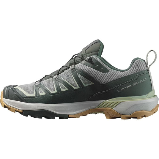 Gray hiking shoe with brown sole on a white background