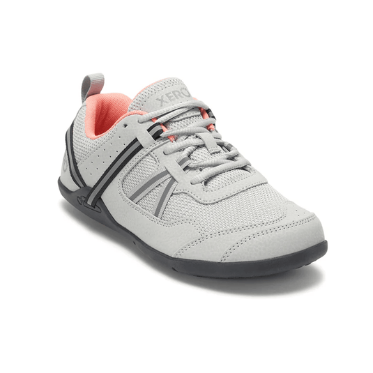 Gray athletic shoe with pink interior on a white background