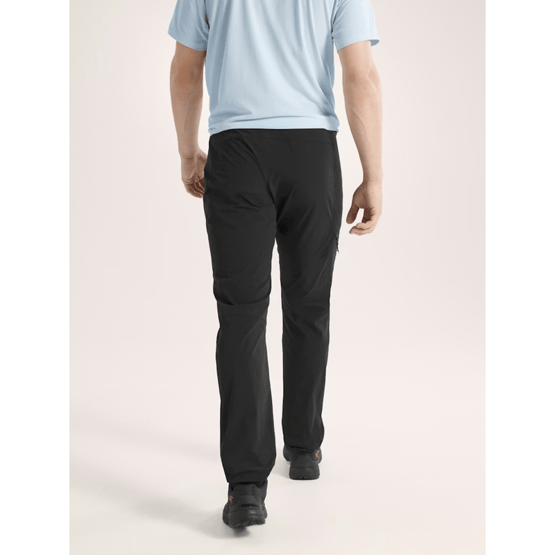 Load image into Gallery viewer, Person wearing black pants and a light blue shirt on a plain background
