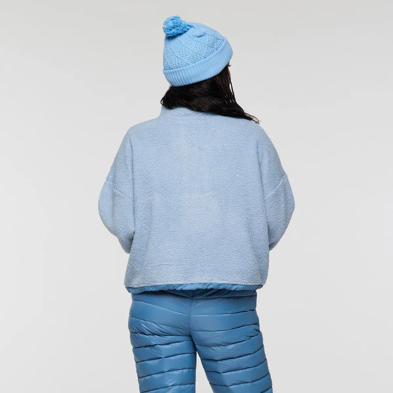 Load image into Gallery viewer, Person wearing a blue knit outfit with a matching beanie on a light gray background
