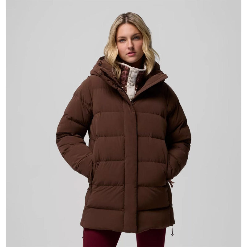 Load image into Gallery viewer, Woman wearing a brown puffer coat on a gray background
