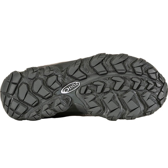 Black shoe sole with tread pattern and Oboz logo on a white background