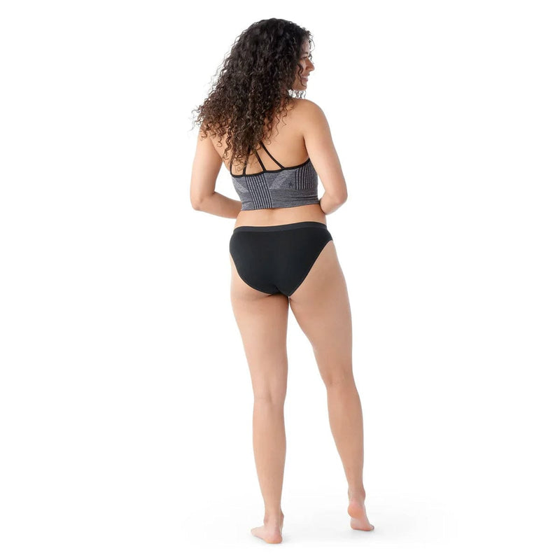 Load image into Gallery viewer, Woman wearing a black bikini with a white background
