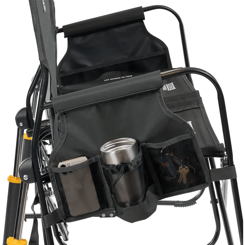 Load image into Gallery viewer, Black storage bag attached to a chair with compartments for items.
