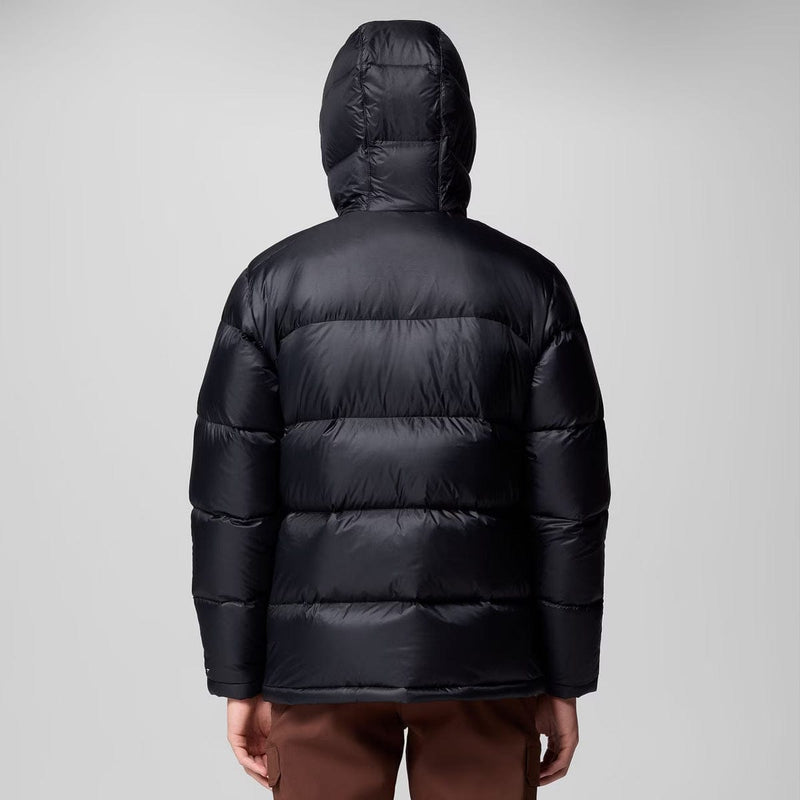Load image into Gallery viewer, Black puffer jacket on a gray background

