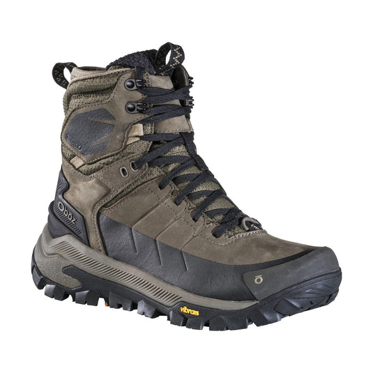 Brown hiking boot with black laces on a white background