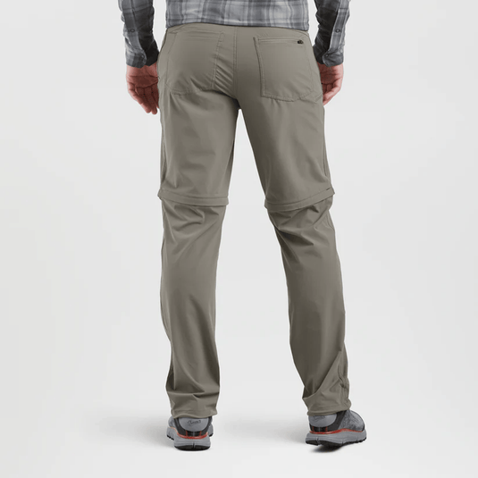 Person wearing beige pants on a white background