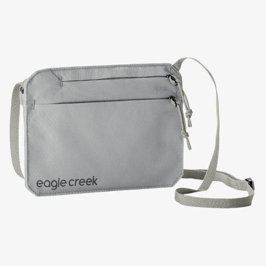 Gray crossbody bag with 'eagle creek' branding on a white background