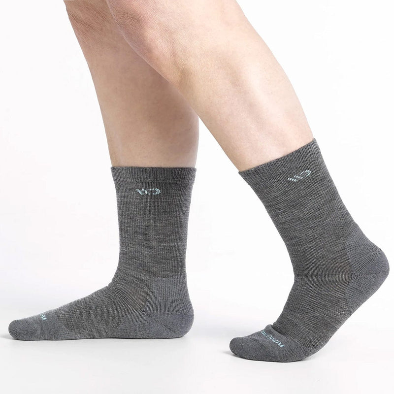 Load image into Gallery viewer, Gray socks worn by a person on a white background
