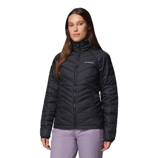 Woman wearing a black Columbia jacket on a white background