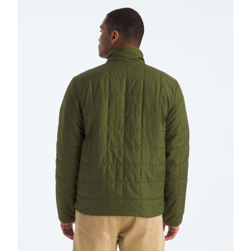 Load image into Gallery viewer, Person wearing a green quilted jacket on a white background
