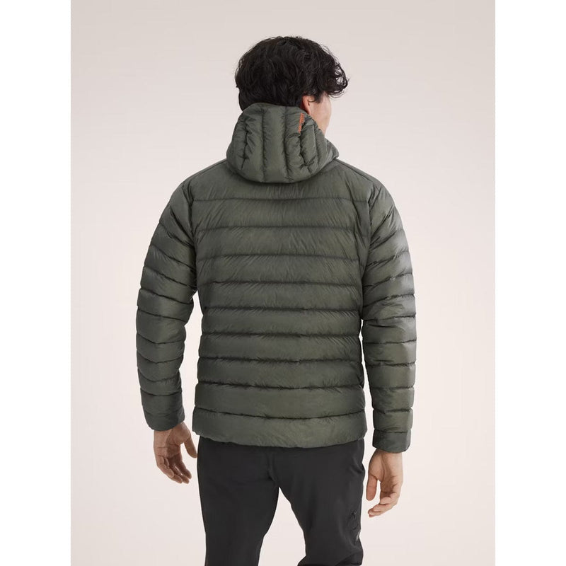 Load image into Gallery viewer, Person wearing a green puffer jacket on a plain background
