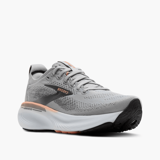 Gray running shoe with black sole on a white background