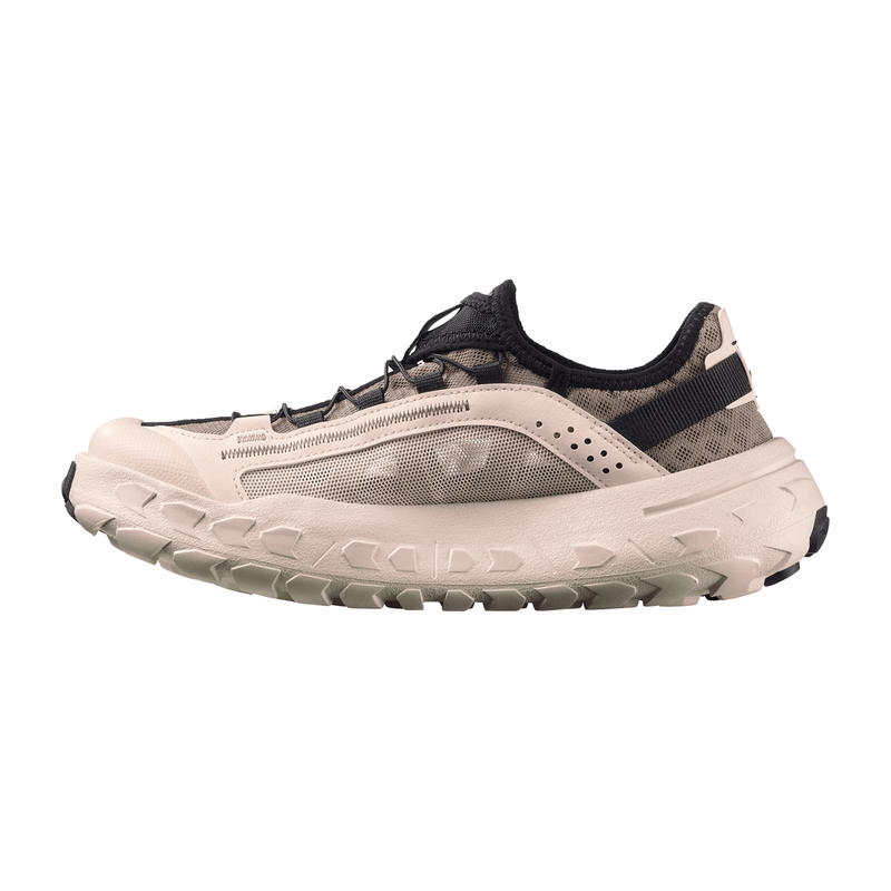Load image into Gallery viewer, Beige and black athletic shoe on a white background
