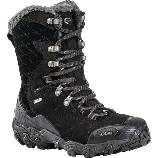 Black winter boot with gray laces and fur lining on a white background