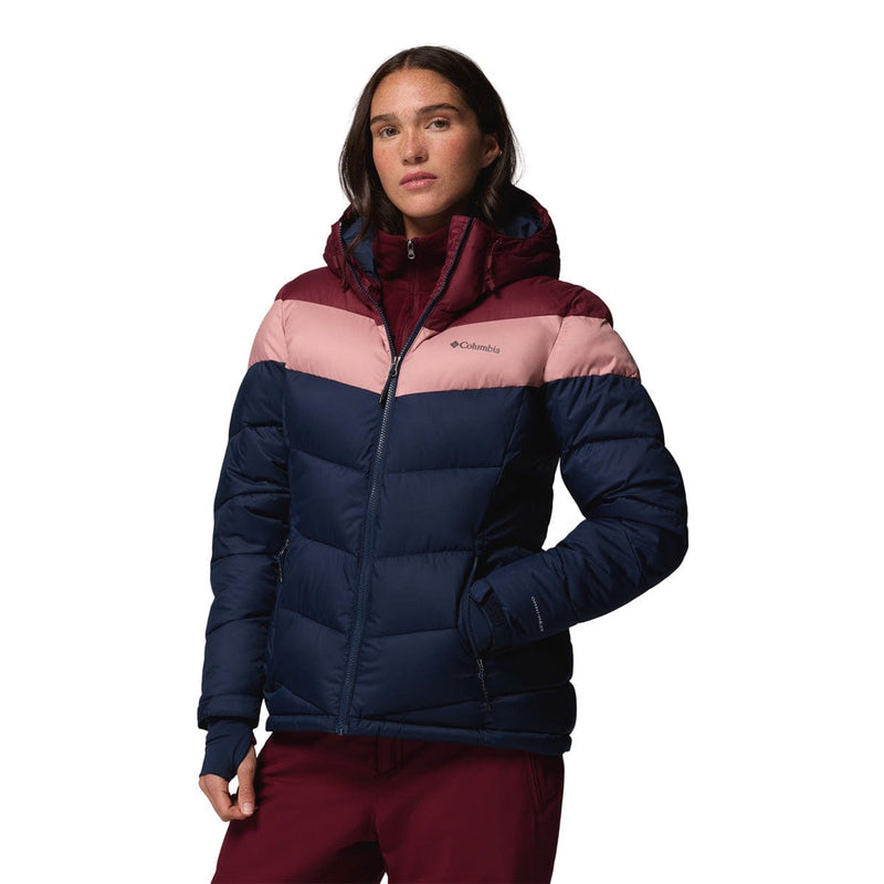 Load image into Gallery viewer, Woman wearing a multicolored puffer jacket on a white background
